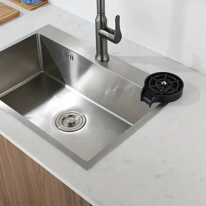 High-Pressure Cup Washer mounted at the edge of a stainless steel kitchen sink