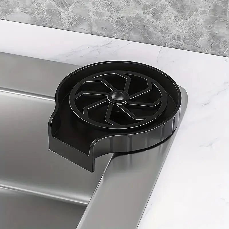 Close-up of the High-Pressure Cup Washer's black jet grate and drainage spout on a benchtop